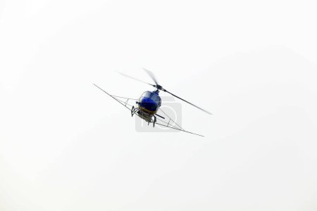 Photo for Agricultural helicopters fly in the air - Royalty Free Image