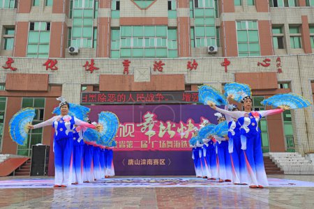 Photo for LUANNAN COUNTY, China - July 1, 2018: sports fitness dance performance in a park, LUANNAN COUNTY, Hebei Province, China - Royalty Free Image