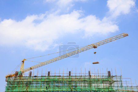 Photo for Tower cranes and scaffolds are on construction sites - Royalty Free Image