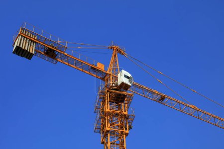 Photo for The tower crane is on the construction site. - Royalty Free Image