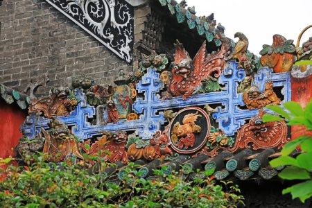 Photo for Guangzhou City, China - April 4, 2019: Beautiful colored sculptures on the roof, in an ancient ancestral hall, Guangzhou City, Guangdong Province, China - Royalty Free Image