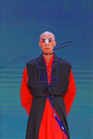 Photo for Luannan County - November 29, 2018: Bald men perform on stage, Luannan County, Hebei Province, Chin - Royalty Free Image