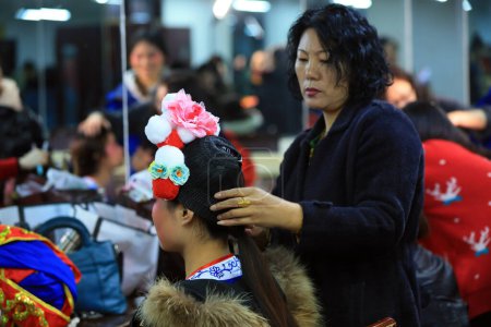 Photo for Luannan County - January 25, 2019: Beijing Opera actresses are putting on makeup, Luannan County, Hebei Province, China - Royalty Free Image