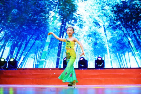 Photo for Luannan County - January 27, 2019: Girls dance on stage, Luannan County, Hebei Province, China - Royalty Free Image
