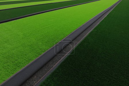 Photo for Artificial lawn laying at sports field - Royalty Free Image