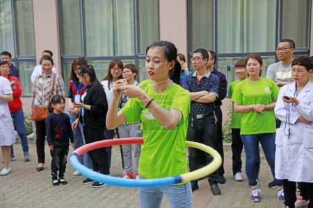 Photo for Luannan County - May 11, 2018: Hula hoop race in the outdoors, Luannan County, Hebei, Chin - Royalty Free Image