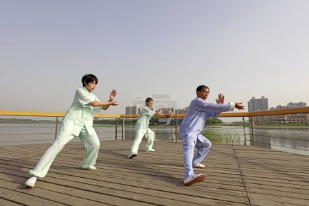 Photo for LUANNAN COUNTY, China - May 27, 2018: People practice Taijiquan in the park, LUANNAN COUNTY, Hebei Province, Chin - Royalty Free Image