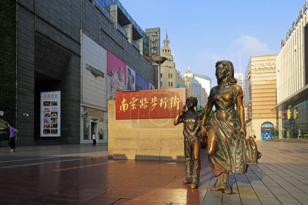 Photo for Shanghai, China - June 1, 2018: Shopper sculpture in pedestrian street in Nanjing Road, Shanghai, China - Royalty Free Image