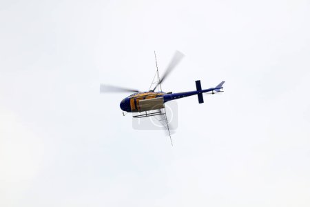 Photo for Agricultural helicopters fly in the air - Royalty Free Image