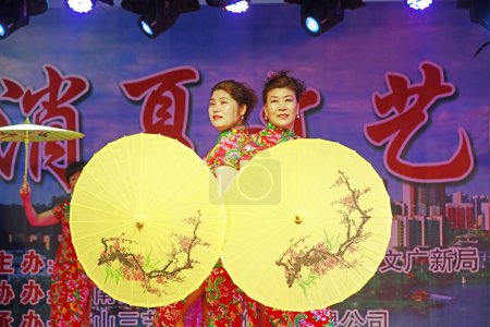 Photo for LUANNAN COUNTY, China - August 30, 2018: Cheongsam show on stage, LUANNAN COUNTY, Hebei Province, China - Royalty Free Image