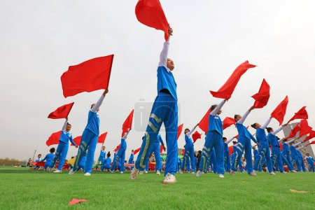 Photo for LUANNAN COUNTY, China - April 8, 2019: Group gymnastics performance at the opening ceremony of the Games, LUANNAN COUNTY, Hebei Province, China - Royalty Free Image