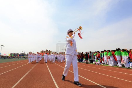 Photo for LUANNAN COUNTY, China - April 8, 2019: The brass band played on the march at the opening ceremony of the sports meeting, LUANNAN COUNTY, Hebei Province, China - Royalty Free Image