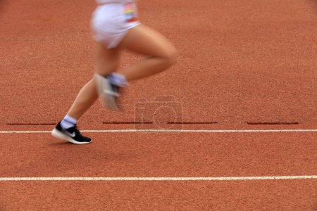 Photo for Long distance runners are running on the track - Royalty Free Image