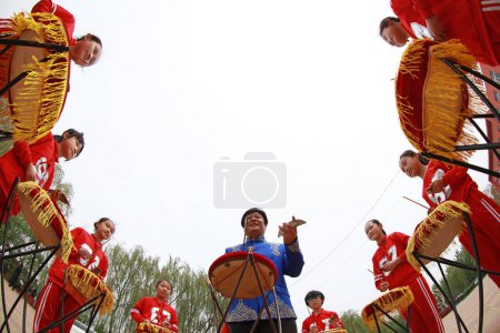 Photo for LUANNAN COUNTY, Hebei Province, China - May 8, 2019: The girls are learning the traditional Chinese drum Book performance. - Royalty Free Image
