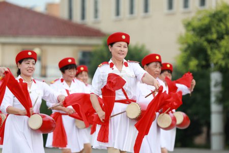 Luannan County, China - July 11, 2019: Old women practicing waist drum performance in the park, Luannan County, Hebei Province, China