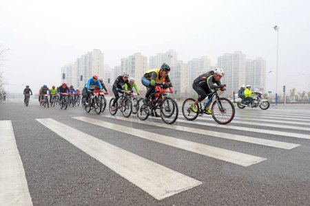 Photo for LUANNAN COUNTY, Hebei Province, China - November 23, 2019: Cyclists are trying to move forward,on a Road cycling competition site. - Royalty Free Image
