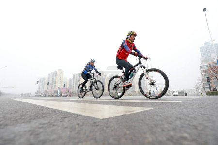 Photo for LUANNAN COUNTY, Hebei Province, China - November 23, 2019: Cyclists are trying to move forward,on a Road cycling competition site. - Royalty Free Image