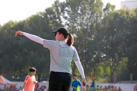 Photo for Luannan County, China - August 24, 2019: Female referees in juvenile handball matches, Luannan County, Hebei Province, China - Royalty Free Image