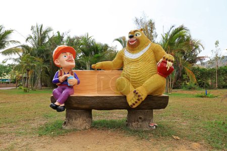Photo for Giant bear and bareheaded cartoon sculpture in park, Sanya, South China - Royalty Free Image