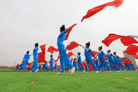 Photo for LUANNAN COUNTY, China - April 8, 2019: Group gymnastics performance at the opening ceremony of the Games, LUANNAN COUNTY, Hebei Province, China - Royalty Free Image
