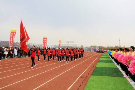 Photo for LUANNAN COUNTY, China - April 11, 2019: Group gymnastics performance at the opening ceremony of the Games, LUANNAN COUNTY, Hebei Province, China - Royalty Free Image