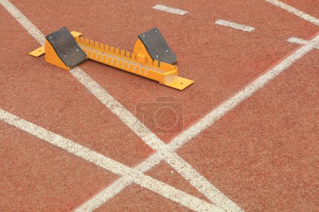 Photo for The starting gear is on the plastic track on the playground - Royalty Free Image