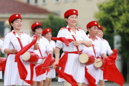 Luannan County, China - July 11, 2019: Old women practicing waist drum performance in the park, Luannan County, Hebei Province, China