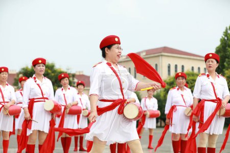Photo for Luannan County, China - July 11, 2019: Old women practicing waist drum performance in the park, Luannan County, Hebei Province, China - Royalty Free Image