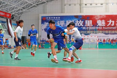 Photo for Luannan County, China - August 24, 2019: Junior Handball Matches in the Gymnasium, Luannan County, Hebei Province, China - Royalty Free Image