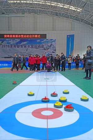 Photo for LUANNAN COUNTY, Hebei Province, China - November 26, 2019: The indoor land curling competition was held at a staff meeting. - Royalty Free Image