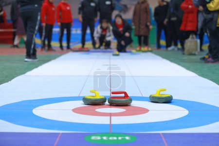 Photo for The indoor land curling competition was held at a staff meeting. - Royalty Free Image