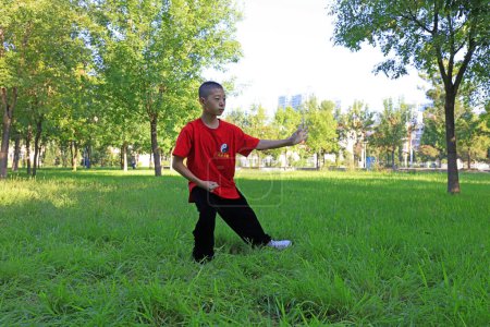 Photo for Luannan County - August 24, 2018: Taijiquan drill in the park, Luannan County, Hebei Province, China - Royalty Free Image