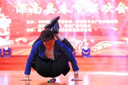 Photo for Luannan County - January 25, 2019: Acrobatic performance on stage, Luannan County, Hebei Province, China - Royalty Free Image