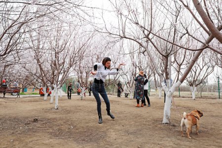 Photo for LUANNAN COUNTY, Hebei Province, China - March 24, 2020: Ladies playing in the park in North China. - Royalty Free Image