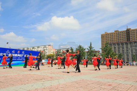 Photo for LUANNAN COUNTY, Hebei Province, China - August 8, 2020: People are doing aerobics in the square - Royalty Free Image