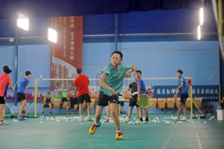 Photo for LUANNAN COUNTY, Hebei Province, China - August 10, 2020: A primary school student takes part in badminton training in the gymnasium - Royalty Free Image