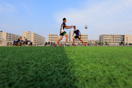 Photo for LUANNAN COUNTY, Hebei Province, China - August 23, 2020: rugby players train on the playground - Royalty Free Image