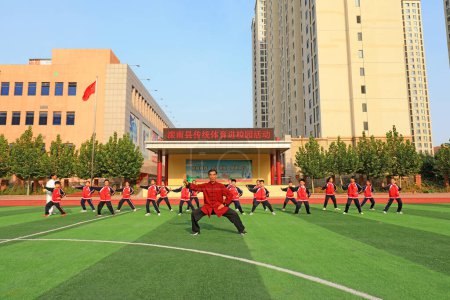 Photo for LUANNAN COUNTY, Hebei Province, China - September 30, 2020: Students practice Taijiquan under the guidance of teachers - Royalty Free Image