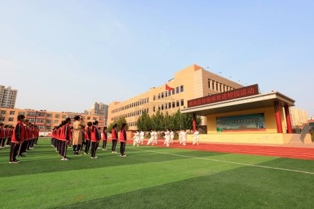 Photo for LUANNAN COUNTY, Hebei Province, China - September 30, 2020: Students practice Taijiquan under the guidance of teachers - Royalty Free Image