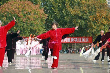 Photo for LUANNAN COUNTY, Hebei Province, China - October 18, 2020: People practice Taiji whisks the dust in the park - Royalty Free Image