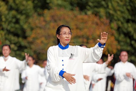 Photo for LUANNAN COUNTY, Hebei Province, China - October 18, 2020: People are practicing Taijiquan in the square - Royalty Free Image