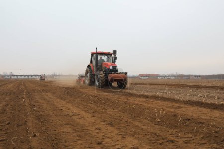 Photo for Seeder sows in the field, North China - Royalty Free Image
