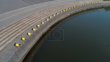 Women practice yoga by the river in the park, aerial photos, North China