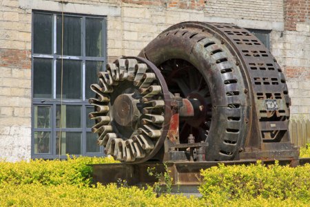 Giant asynchronous motor in a factory, closeup of photo
