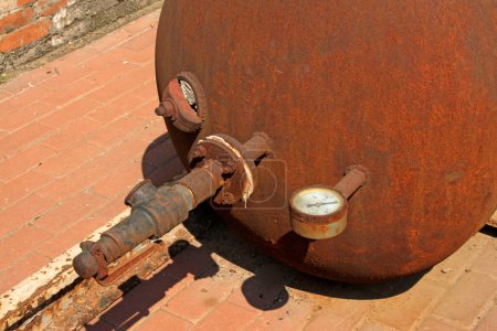 oxidation rust metal tank body, closeup of photo