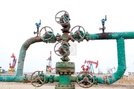 Oil pipeline control handwheel in the wilderness, closeup of phot