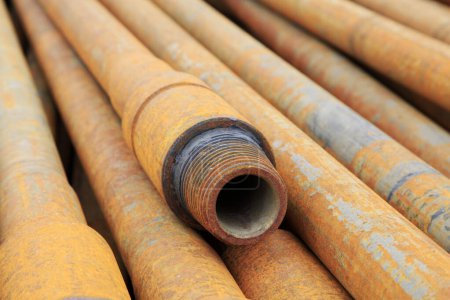 Oil pipe piled up together, closeup of photo