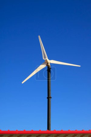 Small wind turbines in the sky closeup of photo