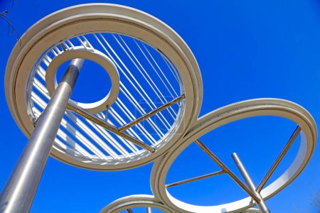 Stainless steel ring landscape architecture under blue sky