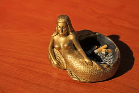 Mermaid shape ashtray, closeup of photo 